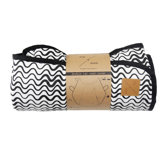 Black and white patterned car seat cover with packaging on a white background