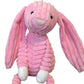 Pink plush bunny dog toy on a white background