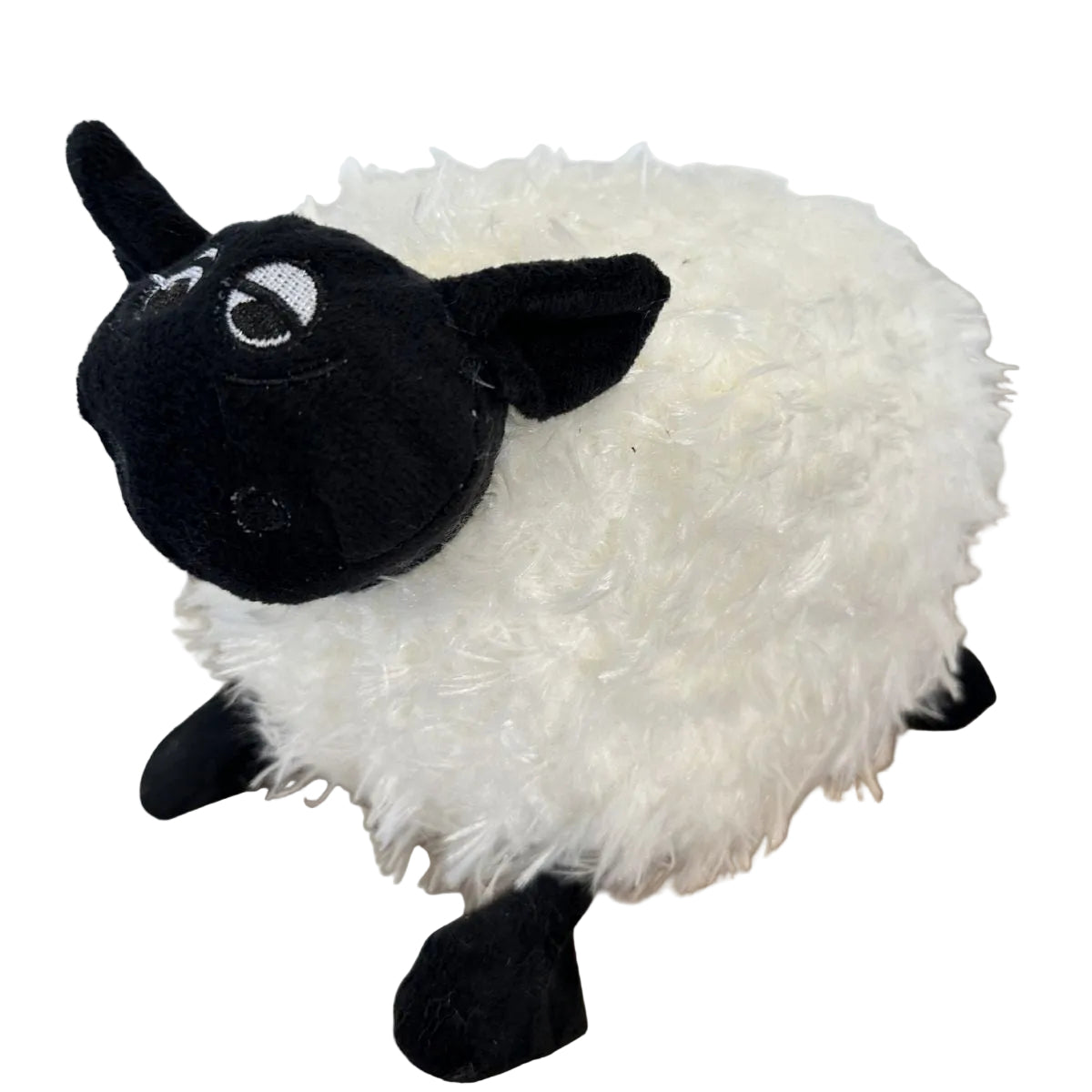 Plush toy sheep with black face and legs on a white background