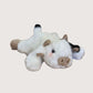 Plush cow dog toy on a white background