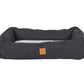 black denim pet bed with a small brown tag on a white background